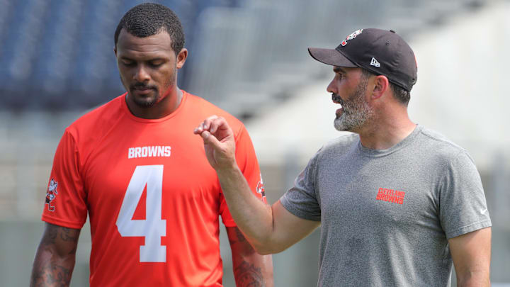 Quarterback Deshaun Watson, talking with coach Kevin Stefanski at a 2022 minicamp session, has only played in 19 of the Browns' 52 games since being acquired from the Texans in 2022.
