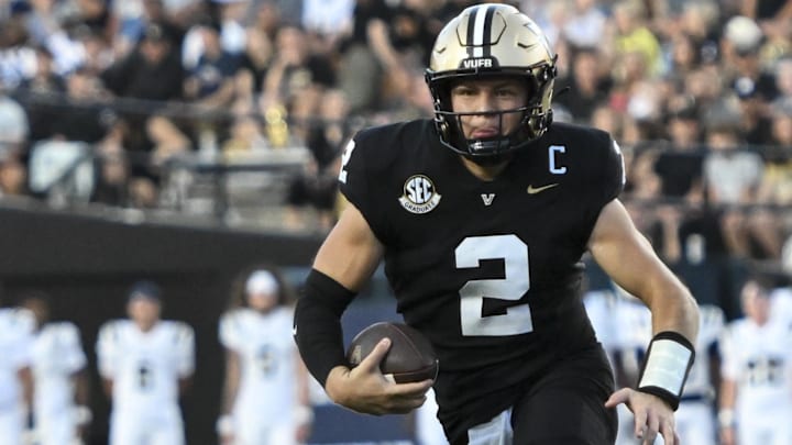 Aug 30, 2025; Nashville, Tennessee, USA;  Vanderbilt Commodores quarterback Diego Pavia (2) runs with the ball against the Charleston Southern Buccaneers during the first half at FirstBank Stadium. 