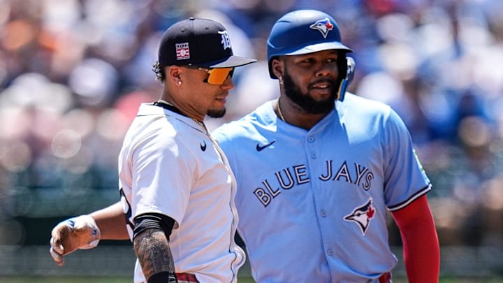 Rivals talk on second base. 