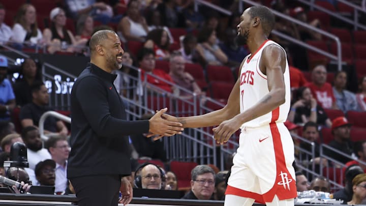 Oct 8, 2025; Houston, Texas, USA; Houston Rockets Head Coach Ime Udoka and forward Kevin Durant (7) react during the third quarter against the Utah Jazz at Toyota Center. Mandatory Credit: Troy Taormina-Imagn Images