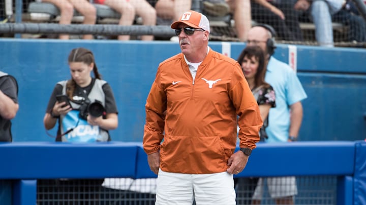 Texas Longhorns head coach Mike White look on in the sixth inning against the Florida Gators during the NCAA Softball Women's College World Series.