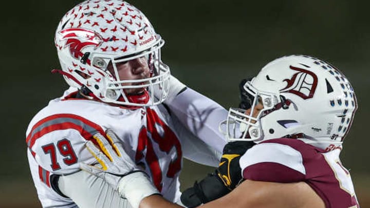 Nixa's Jackson Cantwell (79) blocks De Smet Jesuit's Titan Davis during the Missouri Class 6 Show-Me Bowl in 2024. Cantwell, a Miami Hurricanes commit, is rated the No. 1 2026 prospect in Missouri. Davis, a Michigan Wolverines commit, is rated No. 2.