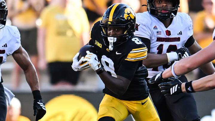 Sep 5, 2026; Iowa City, Iowa, USA; Iowa Hawkeyes wide receiver Evan James (8) runs the ball as Northern Illinois Huskies running back Elijah Porter (24) looks to pursue during the third quarter at Kinnick Stadium. Mandatory Credit: Jeffrey Becker-Imagn Images Sep 5, 2026; Iowa City, Iowa, USA; Iowa Hawkeyes wide receiver Evan James (8) runs the ball as Northern Illinois Huskies running back Elijah Porter (24) looks to pursue during the third quarter at Kinnick Stadium. Mandatory Credit: Jeffrey Becker-Imagn Images