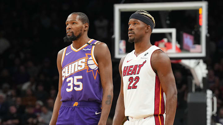 Nov 6, 2024; Phoenix, Arizona, USA; Phoenix Suns forward Kevin Durant (35) and Miami Heat forward Jimmy Butler (22) look on during the first half at Footprint Center. Mandatory Credit: Joe Camporeale-Imagn Images