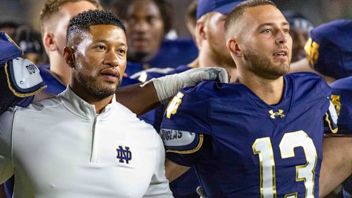 Sep 20, 2025; South Bend, Indiana, USA; Notre Dame Fighting Irish head coach Marcus Freeman and quarterback CJ Carr (13) sing the alma mater after beating the Purdue Boilermakers at Notre Dame Stadium. Sep 20, 2025; South Bend, Indiana, USA; Notre Dame Fighting Irish head coach Marcus Freeman and quarterback CJ Carr (13) sing the alma mater after beating the Purdue Boilermakers at Notre Dame Stadium.