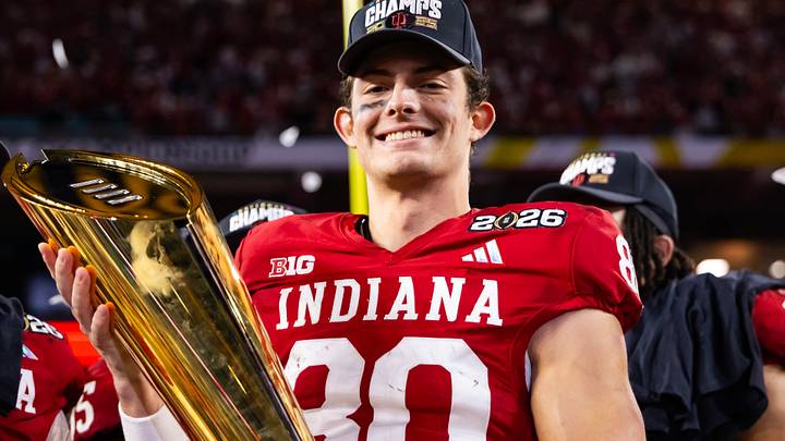 Indiana WR Charlie Becker celebrates with the trophy after defeating Miami in the College Football Playoff National Championship game. Indiana WR Charlie Becker celebrates with the trophy after defeating Miami in the College Football Playoff National Championship game.