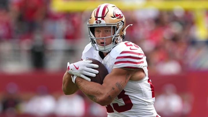 Sep 28, 2025; Santa Clara, California, USA; San Francisco 49ers running back Christian McCaffrey (23) carries the ball against the Jacksonville Jaguars during the second quarter at Levi's Stadium. Mandatory Credit: Darren Yamashita-Imagn Images