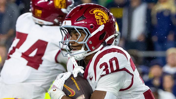 Oct 18, 2025; South Bend, Indiana, USA; Southern California Trojans running back King Miller (30) runs the ball against the Notre Dame Fighting Irish during the first half at Notre Dame Stadium.