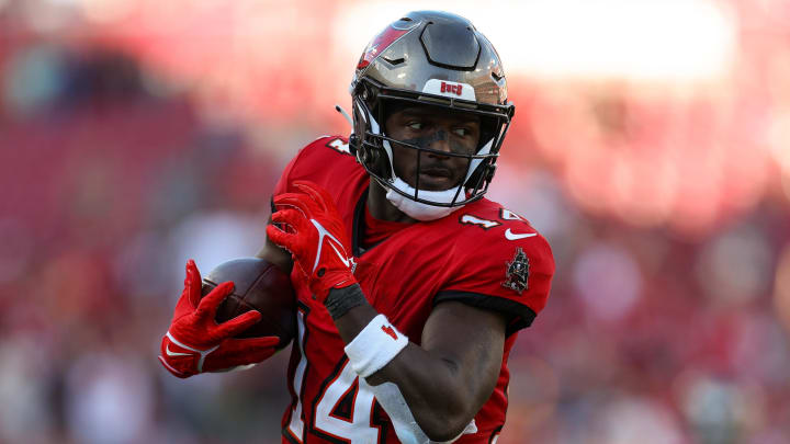 Dec 31, 2023; Tampa, Florida, USA; Tampa Bay Buccaneers wide receiver Chris Godwin (14) catches a pass for a touchdown against the New Orleans Saints in the fourth quarter at Raymond James Stadium. Mandatory Credit: Nathan Ray Seebeck-USA TODAY Sports Dec 31, 2023; Tampa, Florida, USA; Tampa Bay Buccaneers wide receiver Chris Godwin (14) catches a pass for a touchdown against the New Orleans Saints in the fourth quarter at Raymond James Stadium. Mandatory Credit: Nathan Ray Seebeck-USA TODAY Sports