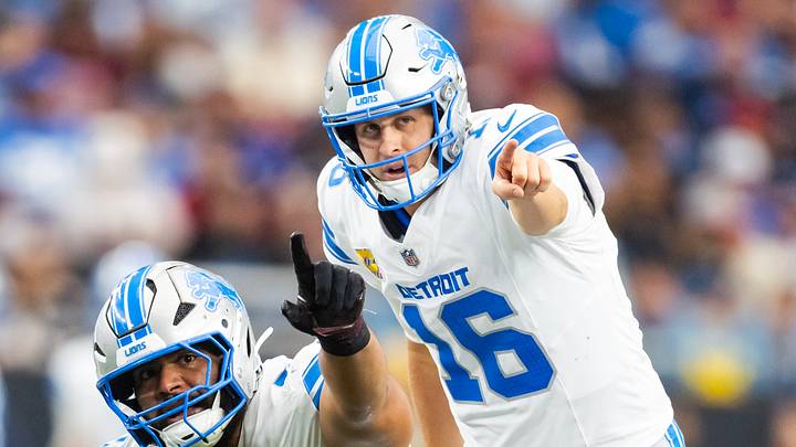 Detroit Lions offensive lineman Juice Scruggs (70) prepares to snap the ball to quarterback Jared Goff (16) against Cardinals Detroit Lions offensive lineman Juice Scruggs (70) prepares to snap the ball to quarterback Jared Goff (16) against Cardinals