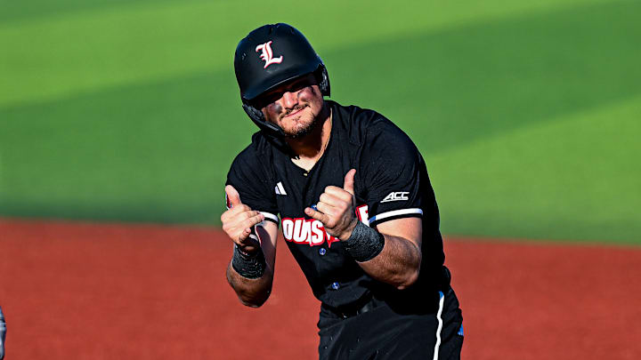 Louisville first baseman Tague Davis celebrates after getting on base against Central Michigan.