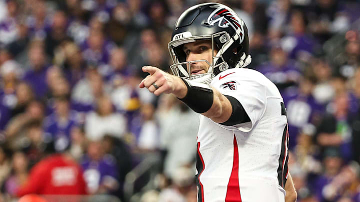 Atlanta Falcons quarterback Kirk Cousins (18) celebrates running back Bijan Robinson's (7) touchdown against the Minnesota Vikings during the third quarter at U.S. Bank Stadium.