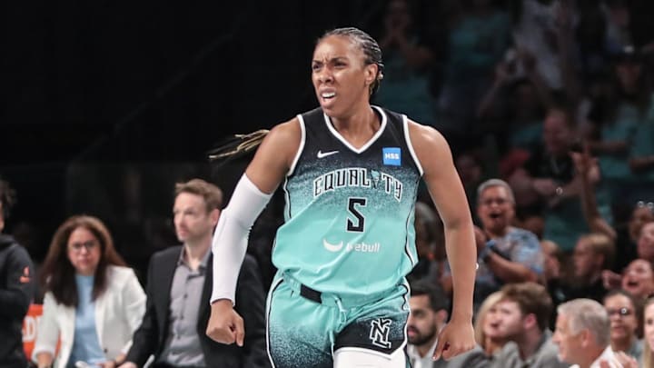 Aug 6, 2023; Brooklyn, New York, USA;  New York Liberty forward Kayla Thornton (5) celebrates after making a three point shot in the third quarter against the Las Vegas Aces at Barclays Center. Mandatory Credit: Wendell Cruz-USA TODAY Sports