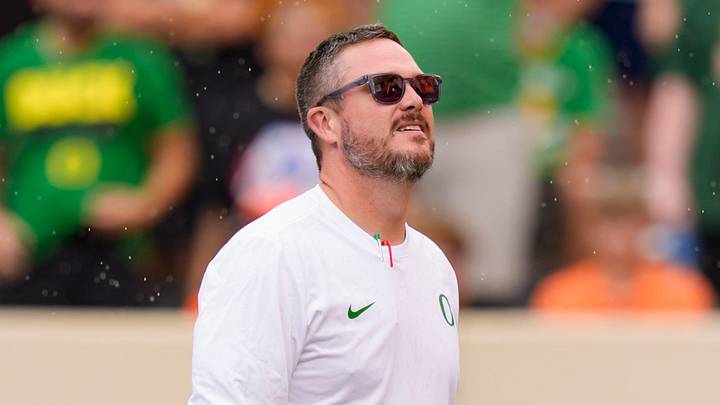 Oregon head coach Dan Lanning takes in the rain as the Oregon Ducks face the Oklahoma State Cowboys on Sept. 12, 2026, at Boone Pickens Stadium in Stillwater, Oklahoma.