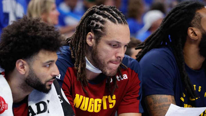 May 18, 2025; Oklahoma City, Oklahoma, USA; Denver Nuggets forward Aaron Gordon (32) looks over a stats sheet in the fourth quarter during game seven of the second round for the 2025 NBA Playoffs against the Oklahoma City Thunder at Paycom Center.