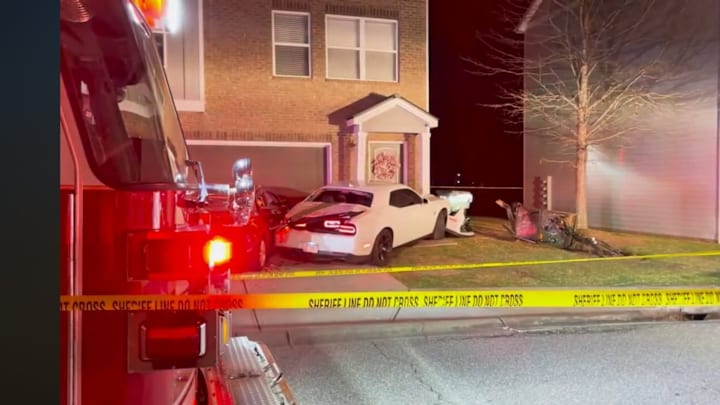 The scene after a Georgia football player is reported to have crashed his car into the front of an apartment house.