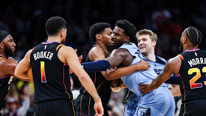 Dec 31, 2024; Phoenix, Arizona, USA; Phoenix Suns guard Devin Booker (1) and forward Ryan Dunn and Memphis Grizzlies guard Cam Spencer (24) and forward-center Jaren Jackson Jr. (13) react during the fourth quarter of the game at Footprint Center. Mandatory Credit: Aryanna Frank-Imagn Images Dec 31, 2024; Phoenix, Arizona, USA; Phoenix Suns guard Devin Booker (1) and forward Ryan Dunn and Memphis Grizzlies guard Cam Spencer (24) and forward-center Jaren Jackson Jr. (13) react during the fourth quarter of the game at Footprint Center. Mandatory Credit: Aryanna Frank-Imagn Images
