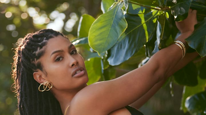 Leyna Bloom was photographed by Amanda Pratt in Dominica. Swimsuit by Norma Kamali. Earrings by Alexis Bittar. Bracelets by Eklexic Jewelry.
