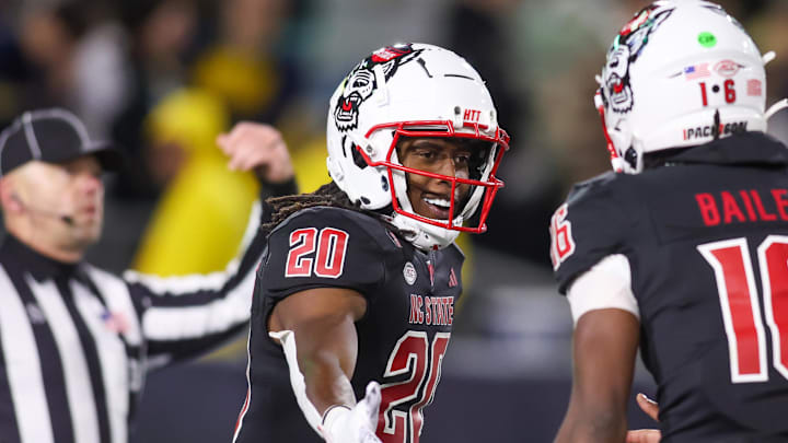 Nov 21, 2024; Atlanta, Georgia, USA; North Carolina State Wolfpack running back Hollywood Smothers (20) celebrates after a touchdown run against the Georgia Tech Yellow Jackets in the fourth quarter at Bobby Dodd Stadium at Hyundai Field. Mandatory Credit: Brett Davis-Imagn Images Nov 21, 2024; Atlanta, Georgia, USA; North Carolina State Wolfpack running back Hollywood Smothers (20) celebrates after a touchdown run against the Georgia Tech Yellow Jackets in the fourth quarter at Bobby Dodd Stadium at Hyundai Field. Mandatory Credit: Brett Davis-Imagn Images