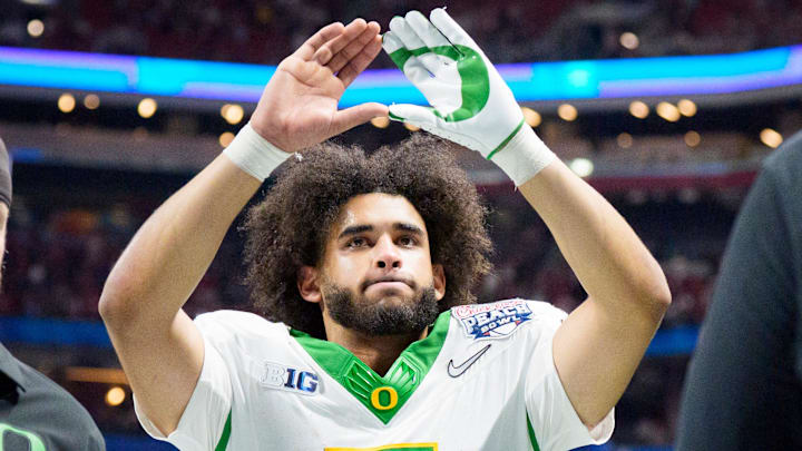 Oregon quarterback Dante Moore walks off the field as the Oregon Ducks face the Indiana Hoosiers in the Peach Bowl on Jan. 9, 2026, at Mercedes-Benz Stadium in Atlanta, Georgia.