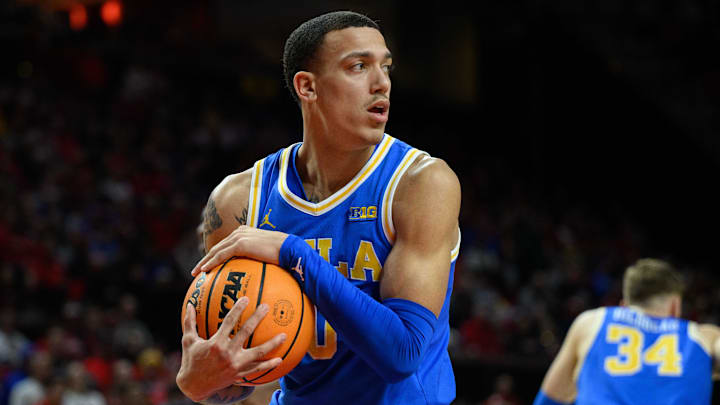 Jan 10, 2025; College Park, Maryland, USA; UCLA Bruins guard Kobe Johnson (0) grabs a rebound during the first half against the Maryland Terrapins at Xfinity Center. Mandatory Credit: Reggie Hildred-Imagn Images