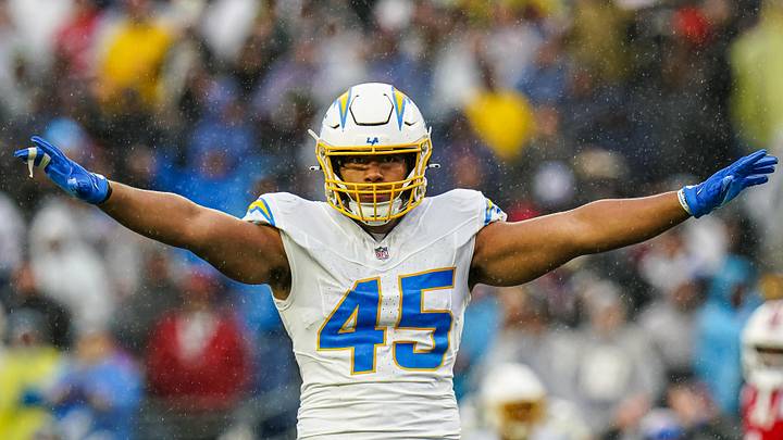 Dec 3, 2023; Foxborough, Massachusetts, USA; Los Angeles Chargers linebacker Tuli Tuipulotu (45) reacts after stoping the first down against the New England Patriots in the second quarter at Gillette Stadium. Mandatory Credit: David Butler II-Imagn Images