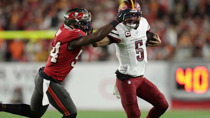 Tampa Bay Buccaneers linebacker Lavonte David tackles Washington Commanders quarterback Jayden Daniels during last season's playoffs.