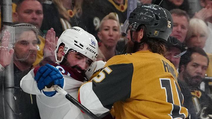 May 24, 2026; Las Vegas, Nevada, USA; Colorado Avalanche center Nazem Kadri (91) is boarded by Vegas Golden Knights defenseman Noah Hanifin (15) during the second period in game three of the Western Conference Final of the 2026 Stanley Cup Playoffs at T-Mobile Arena. Mandatory Credit: Stephen R. Sylvanie-Imagn Images