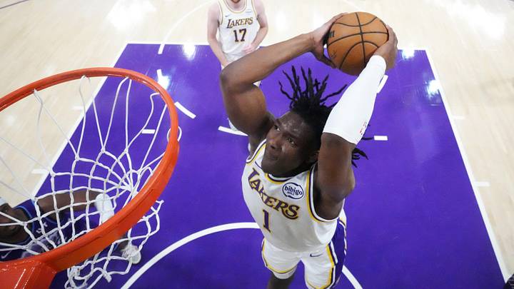 Apr 12, 2026; Los Angeles, California; Los Angeles Lakers forward Adou Thiero (1) dunks the ball against the Utah Jazz  in the second half at Crypto.com Arena. Mandatory Credit: Kirby Lee-Imagn Images