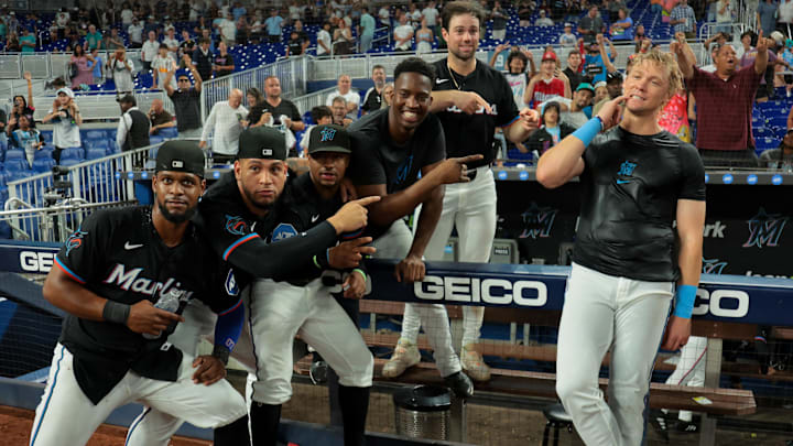 Miami Marlins left fielder Kyle Stowers (right) celebrates with teammates after hitting a two-run walk-off home run. 