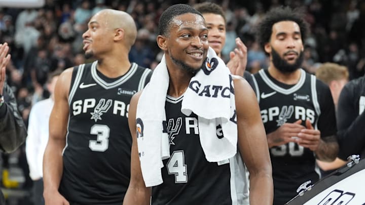 Jan 17, 2026; San Antonio, Texas, USA; San Antonio Spurs guard De'aaron Fox (4) gets ready to beat the drum after the game against the Minnesota Timberwolves at Frost Bank Center. Mandatory Credit: Daniel Dunn-Imagn Images