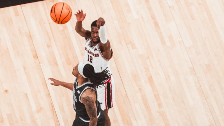 Senior guard Donovan Atwell (12) sinks another 3-pointer breaking the single season record for made 3-pointers. In No. 13 Texas Tech's 100-72 win over Kansas State on February 21st at United Markets Arena  