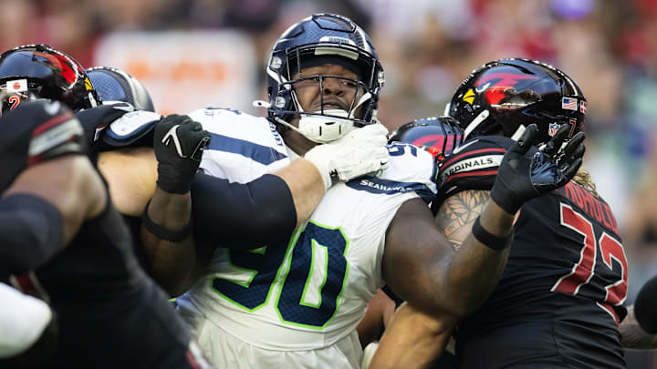 Dec 8, 2024; Glendale, Arizona, USA; Seattle Seahawks defensive tackle Jarran Reed (90) against the Arizona Cardinals at State Farm Stadium. Dec 8, 2024; Glendale, Arizona, USA; Seattle Seahawks defensive tackle Jarran Reed (90) against the Arizona Cardinals at State Farm Stadium.