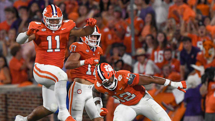 Clemson defensive lineman T.J. Parker (12) reacts with defensive lineman Peter Woods (11) are two of three Tigers named to the Bednarik Award Watch List.