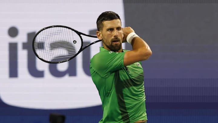 Novak Djokovic returns a shot.