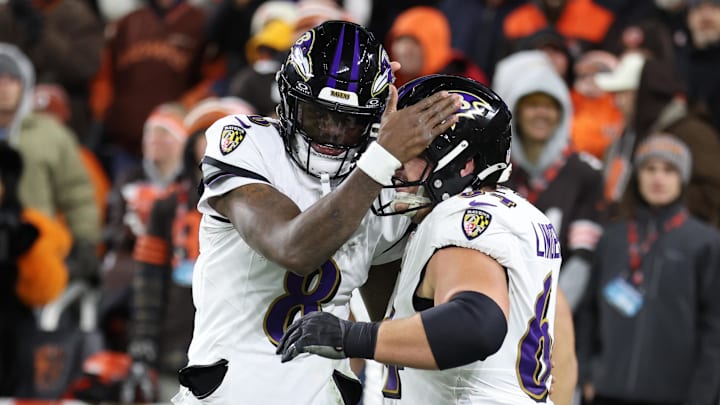 Nov 16, 2025; Cleveland, Ohio, USA; Baltimore Ravens quarterback Lamar Jackson (8) and center Tyler Linderbaum (64) celebrate a touchdown during the fourth quarter against the Cleveland Browns at Huntington Bank Field. Mandatory Credit: Scott Galvin-Imagn Images
