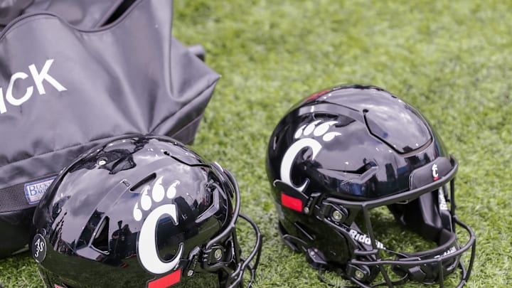 Oct 30, 2021; New Orleans, Louisiana, USA; Cincinnati Bearcats helmets on the ground during the game against Tulane Green Wave during the second half at Yulman Stadium. Mandatory Credit: Stephen Lew-Imagn Images Oct 30, 2021; New Orleans, Louisiana, USA; Cincinnati Bearcats helmets on the ground during the game against Tulane Green Wave during the second half at Yulman Stadium. Mandatory Credit: Stephen Lew-Imagn Images