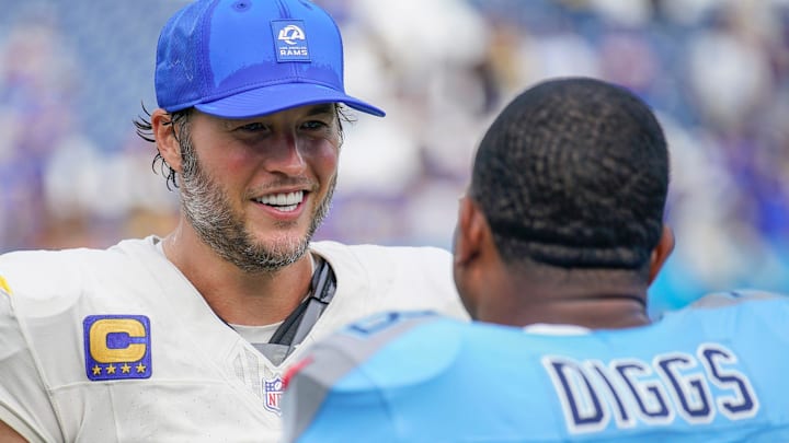 Los Angeles Rams quarterback Matthew Stafford (9) and former Tennessee Titans safety Quandre Diggs (28) talk 