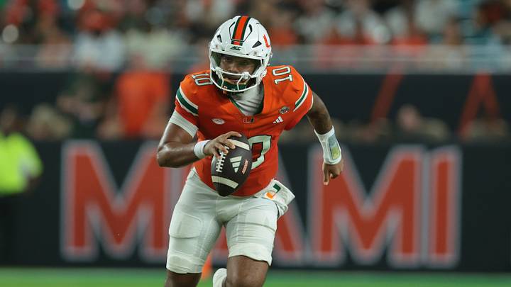 Sep 10, 2026; Miami Gardens, Florida, USA;  Miami Hurricanes quarterback Darian Mensah (10) runs with the ball in the second quarter against the Florida A&M Rattlers at Hard Rock Stadium.  Mandatory Credit: Sam Navarro-Imagn Images
