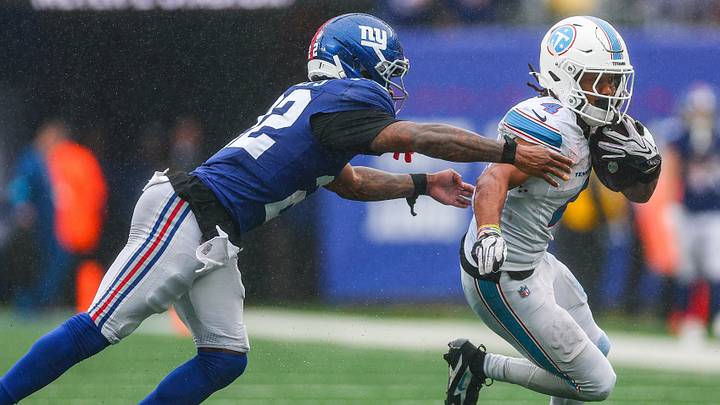 Sep 27, 2026; East Rutherford, New Jersey, USA; Tennessee Titans wide receiver Wan'Dale Robinson (4) is tackled by New York Giants cornerback Dru Phillips (22) during the second half at MetLife Stadium. Mandatory Credit: Vincent Carchietta-Imagn Images Sep 27, 2026; East Rutherford, New Jersey, USA; Tennessee Titans wide receiver Wan'Dale Robinson (4) is tackled by New York Giants cornerback Dru Phillips (22) during the second half at MetLife Stadium. Mandatory Credit: Vincent Carchietta-Imagn Images