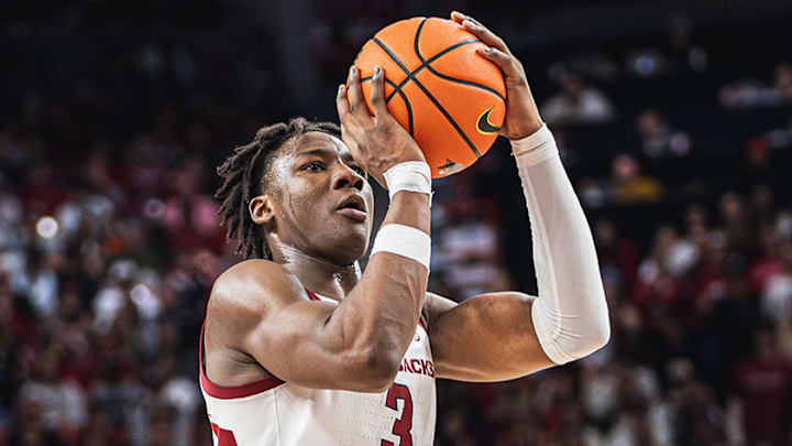 Adou Thiero (3) shoots a three against the Oklahoma Sooners inside Bud Walton Arena. The Sooners won 65-62. Adou Thiero (3) shoots a three against the Oklahoma Sooners inside Bud Walton Arena. The Sooners won 65-62.