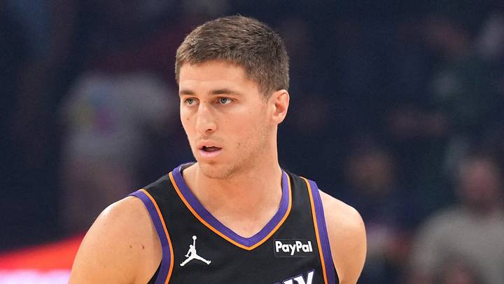 Phoenix Suns guard Collin Gillespie (12) dribbles against the Milwaukee Bucks during the first half at Mortgage Matchup Center on March 21, 2026.