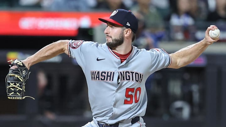 Washington Nationals relief pitcher PJ Poulin (50) pitches in the eleventh inning against the New York Mets at Citi Field.