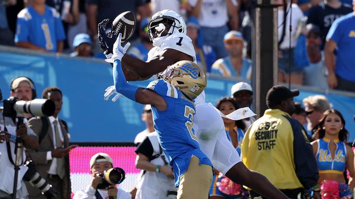 Oct 4, 2025; Pasadena, California, USA;  Penn State Nittany Lions wide receiver Kyron Hudson (1) catches a pass over UCLA Bruins defensive back Andre Jordan Jr. (2) for a touchdown during the fourth quarter at Rose Bowl. Mandatory Credit: Kiyoshi Mio-Imagn Images