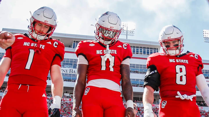 Oct 4, 2025; Raleigh, North Carolina, USA; NC State Wolfpack quarterback CJ Bailey (11), linebacker Caden Fordham (1), wide receiver Keenan Jackson (8) during the coin toss prior to the first half of the game against Campbell Fighting Camels at Carter-Finley Stadium. Mandatory Credit: Jaylynn Nash-Imagn Images Oct 4, 2025; Raleigh, North Carolina, USA; NC State Wolfpack quarterback CJ Bailey (11), linebacker Caden Fordham (1), wide receiver Keenan Jackson (8) during the coin toss prior to the first half of the game against Campbell Fighting Camels at Carter-Finley Stadium. Mandatory Credit: Jaylynn Nash-Imagn Images