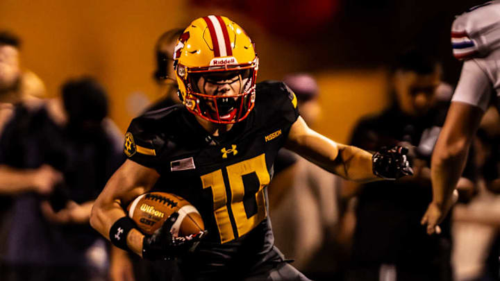 Mission Viejo's Jordan Hicks runs with the ball in a game against Folsom earlier this year. 