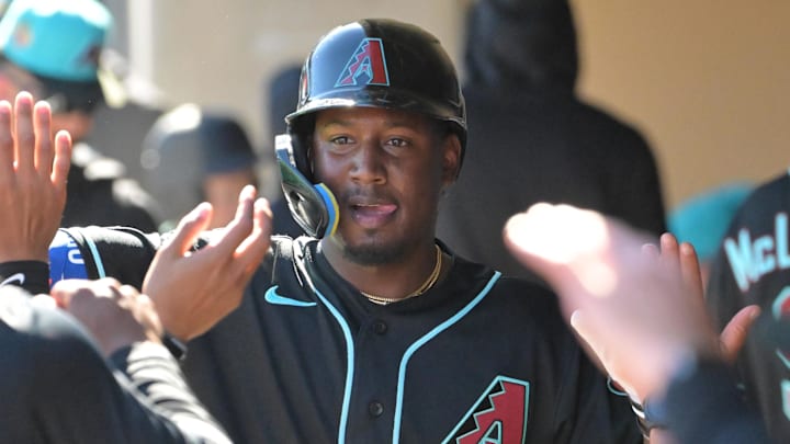 Feb 22, 2026; Salt River Pima-Maricopa, Arizona, USA; Arizona Diamondbacks shortstop Geraldo Perdomo (2) in the dugout after scoring a run in the third inning against the Los Angeles Angels at Salt River Fields at Talking Stick. Mandatory Credit: Jayne Kamin-Oncea-Imagn Images