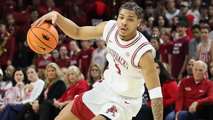Arkansas Razorbacks guard Darius Acuff Jr (5) dribbles during the first half against the Auburn Tigers at Bud Walton Arena. 