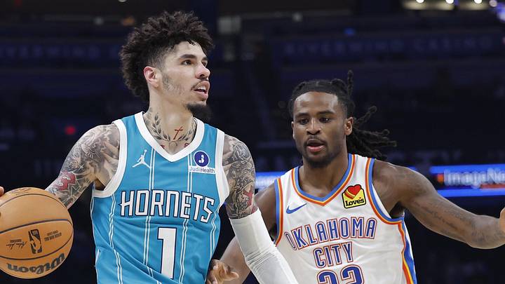 Oct 9, 2025; Oklahoma City, Oklahoma, USA; Charlotte Hornets guard Lamelo Ball (1) moves the ball down the court beside Oklahoma City Thunder guard Cason Wallace (22) during the second half of a game between the Charlotte Hornets and the Oklahoma City Thunder at Paycom Center. Mandatory Credit: Alonzo Adams-Imagn Images
