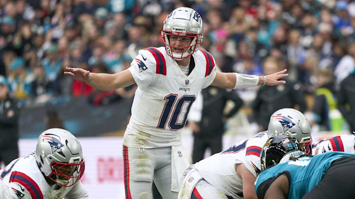 Oct 20, 2024; London, United Kingdom; New England Patriots quarterback Drake Maye (10) signs to players in the first half during an NFL International Series game at Wembley Stadium. Mandatory Credit: Peter van den Berg-Imagn Images Oct 20, 2024; London, United Kingdom; New England Patriots quarterback Drake Maye (10) signs to players in the first half during an NFL International Series game at Wembley Stadium. Mandatory Credit: Peter van den Berg-Imagn Images